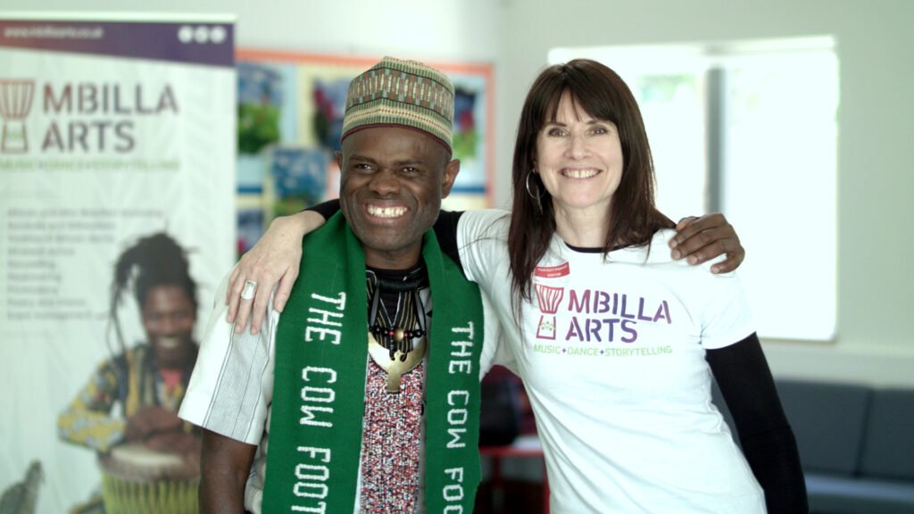 A man and women involved in the London Borough of Culture project stand arm in arm smiling